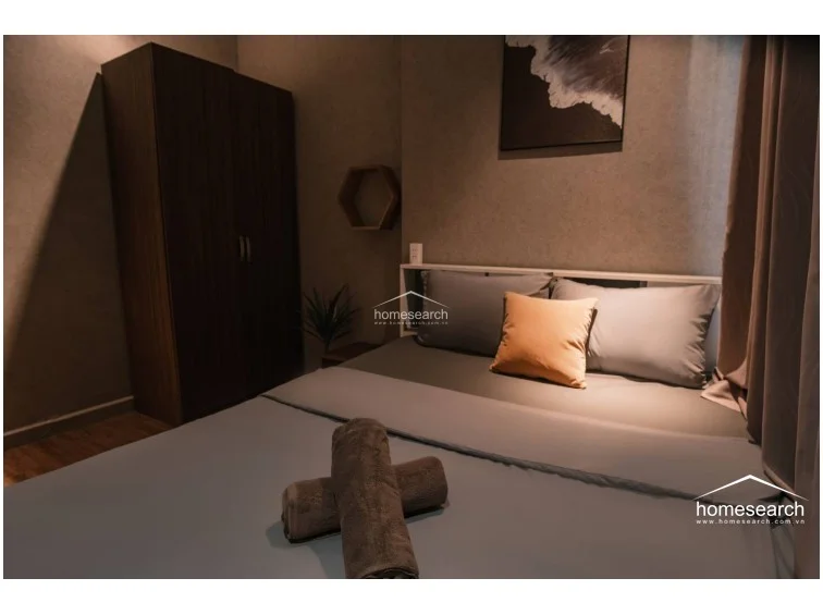 This final perspective showcases the room's thoughtful details, such as the hexagonal wall shelf and soft drapery that adds texture to the space. The room maintains a consistent design language, blending industrial-inspired wall finishes with warm wood tones for a balanced, inviting feel.