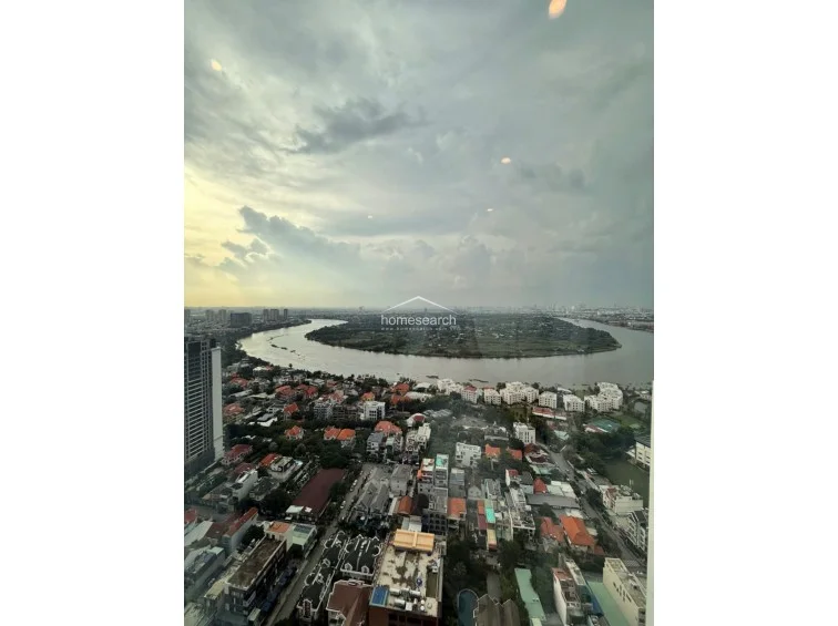This high-floor window view offers a breathtaking, unobstructed panoramic vista of the meandering river and the surrounding urban landscape. The perspective emphasizes the property's prime location, providing a sense of openness and tranquility from the comfort of the interior.