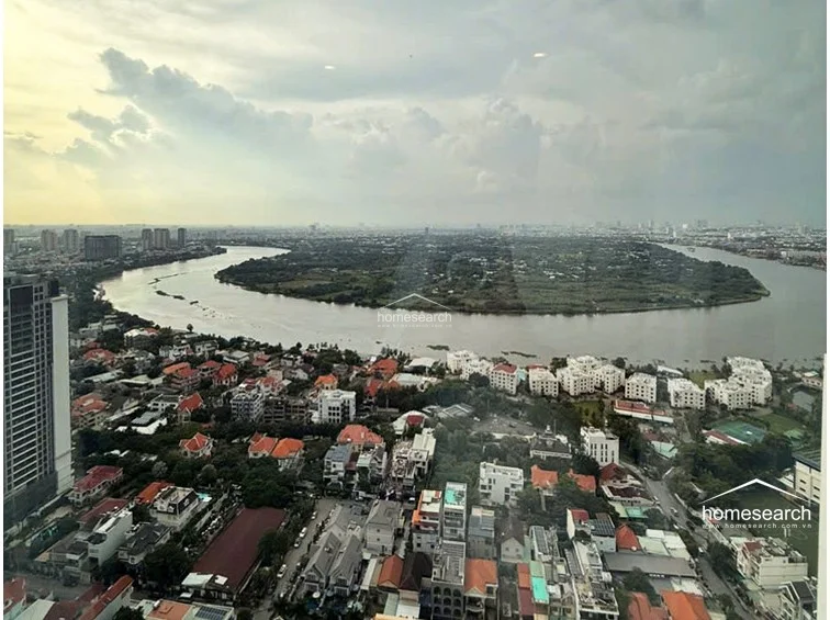 This high-rise vantage point provides a breathtaking, panoramic view of the winding river and the surrounding urban landscape. The perspective emphasizes the property's prime location, offering an unobstructed, scenic outlook that enhances the sense of space and tranquility.