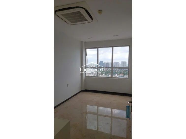 This bedroom features polished marble-style flooring and neutral white walls, creating a bright and clean atmosphere. It is equipped with a ceiling-mounted cassette AC unit and offers an expansive city view through a large, multi-pane window.